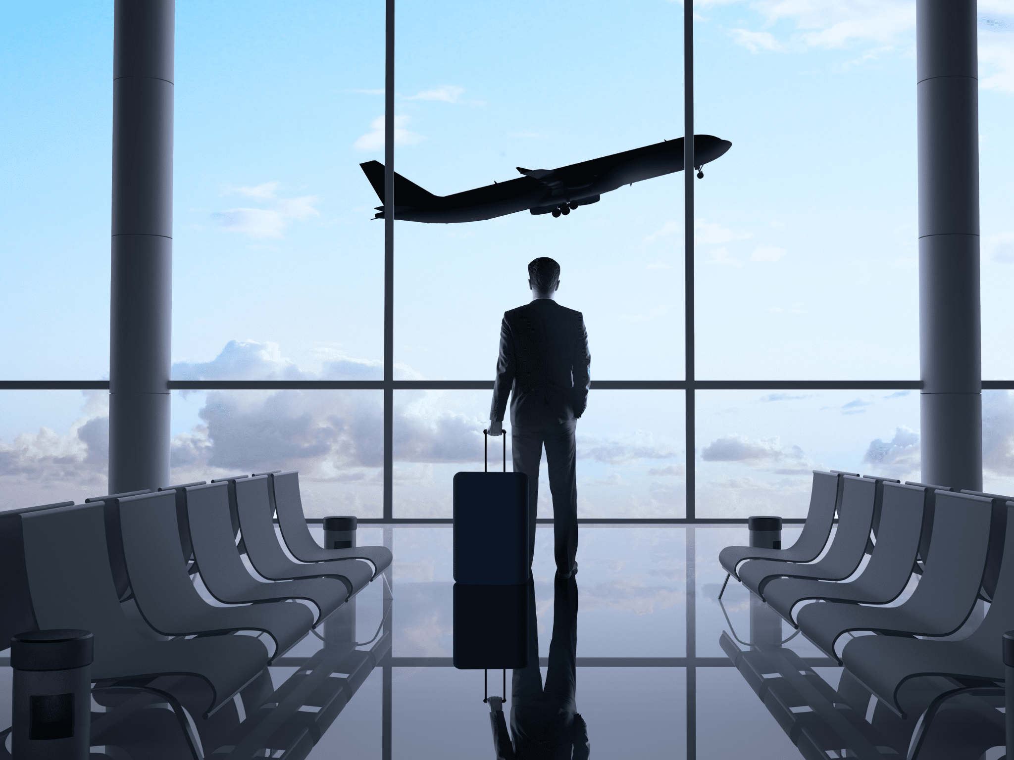 Business traveler near airport window